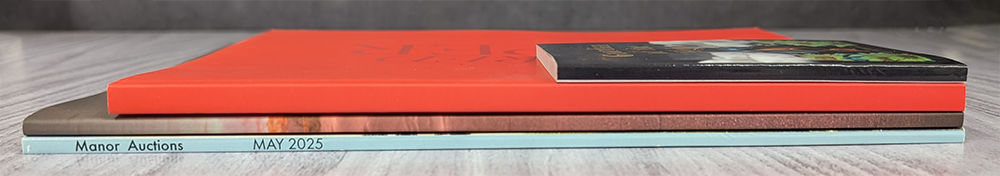 Stack of Perfect Bound books and magazines, various sizes and colors