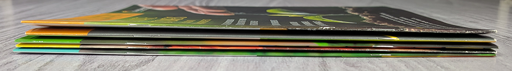 Saddle stitched (staple) spines of five magazines