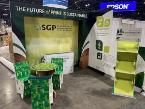 SGP fully recyclable tradeshow booth with literature holder, table and chairs, and console table
