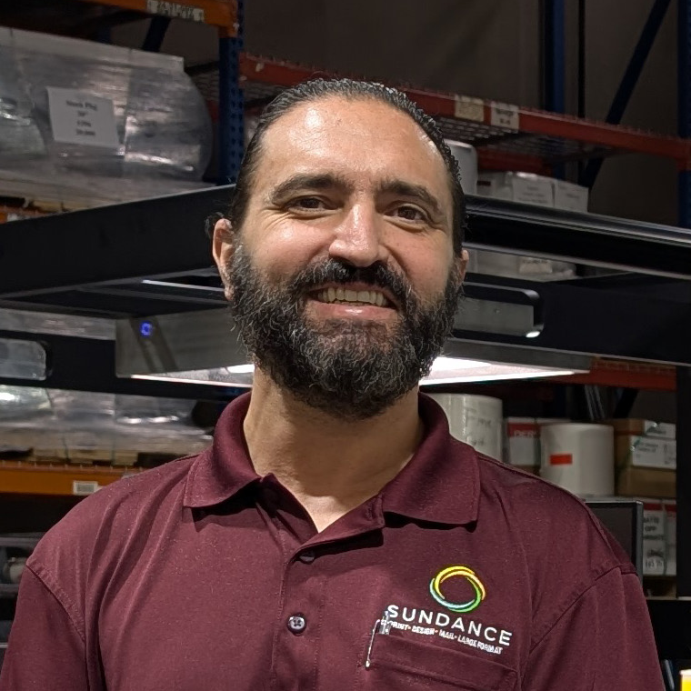 SunDance president JohnHenry Ruggieri in a maroon polo shirt with the SunDance logo