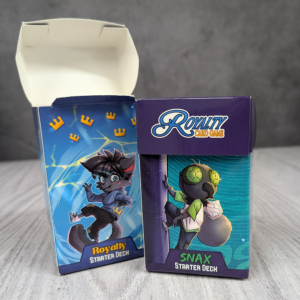 Two Royalty card game card boxes, one open and one closed